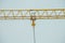 Closeup on part of yellow construction crane chain