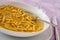 Closeup of Passatelli in broth original Italian pasta