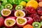 Closeup passion fruits with group of fresh fruits and vegetables