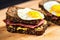 closeup of a pastrami sandwich on rye bread, mustard dripping