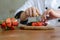 Closeup of a pastry chef decorating dessert with strawberry in t