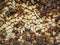 Closeup pattern of a stack of split logs, old dusty firewood. Pile texture of dry chopped wood