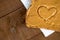 Closeup of peanut butter toast with heart shape on tissue