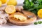 Closeup of peeled ginger root on wooden board