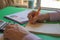 Closeup pen on paperwork accounts with man use calculator. Man hand with pen, calculator on table