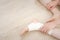 Closeup People of a Foot with White Gauze Elastic Bandage. Hands on Injured Legs and Feet on Pain Area. Asian Young Woman Ankle