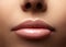 Closeup perfect natural lip makeup. Beautiful plump full lips on female face. Clean skin, fresh make-up. Spa tender lips