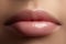 Closeup perfect natural lip makeup. Beautiful plump full lips on female face. Clean skin, fresh make-up. Spa tender lips