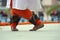 Closeup of a person with Ghungroo on their feet while dancing the Indian Kathakali dance