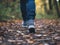 closeup of a person\\\'s feet walking alone on an old path