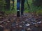 closeup of a person\\\'s feet walking alone on an old path