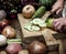 Closeup of person slicing vegetables