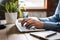 Closeup person typing on computer keyboard, professional workspace