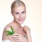 Closeup personable woman hold green leaf as cannabis beauty concept.
