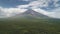 Closeup Philippines volcano haze eruption aerial. Green grass landmark of Mayon mountain