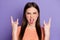 Closeup photo of attractive crazy funky lady long brown straight hairstyle show finger horns sticking tongue wear casual