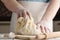 Closeup photo of baker making yeast dough for bread.