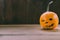 Closeup Photo of Carved Baby Pumpkin on the Wodden Background