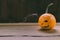 Closeup Photo of Carved Baby Pumpkin on the Wodden Background