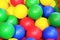 Closeup photo with colorful balls for kids - green, yellow, red and blue