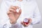 Closeup photo cropped picture of happy cheerful excited glad positive optimistic guy holding small little ring in hand with