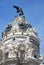 Closeup photo with decorations and sculptures on the Metropolitan building in Madrid, Spain