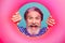 Closeup photo of excited funny aged guy seaman open mouth tourist look inside pink rubber float lifebuoy good mood wear