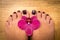 Closeup photo of a female feet with pedicure on nails and orchid