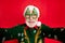 Closeup photo of funny aged santa claus role man making crazy selfies wear x-mas tree shape specs knitted sweater hat
