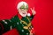 Closeup photo of funny aged santa claus role man making selfies showing v-sign symbol wear x-mas tree shape specs ugly