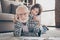 Closeup photo of grandpa spend time little granddaughter lying comfy fluffy floor carpet painting together hugging best