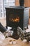 Closeup photo of human feet in warm woolen socks over fire place