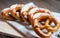 Closeup photo of lye bun and bavarian pretzel in bakery