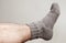 Closeup photo of male foot with woolen sock