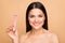 Closeup photo of mature latin naked lady in bathroom holding new shaver model recommending good quality product advert