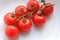 Closeup photo with mature red delicious small tomatoes