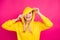 Closeup photo of nice lady hiding eyes with hood wear yellow hoodie pullover isolated pink background
