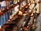 Closeup photo of oil lamps and lanterns burning in the place of worship at buddhist temple