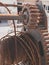 Closeup photo of old rusty winch and metal cable in sea port