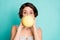 Closeup photo of pretty funky lady big eyes holding big chewing gum inside mouth blowing bubble wear casual white dotted