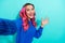 Closeup photo selfie of youngster hipster excited good mood girl wavy dyed hair raise palm hello sign person blog