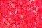 Closeup photo of shiny pink red vivid small mini hearts background