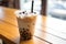 Closeup Photo Showcases Tantalizing Taiwan Milk Bubble Tea, Also Known As Boba, In Plastic Cup On Wo