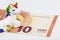 Closeup photo on a small cute white and rainbow unicorn sculpture together with a 10 Euro banknote, the official currency of EU