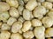 A closeup photo of a stack of potatoes in the fresh ingredient market