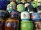 Closeup photo of Various painted ceramic pots for sale at a street near Kolkata,Flower vase for decoration,Picture is on selective