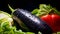 Closeup photo of water droplets falling on fresh eggplant, lettuce and bell pepper. Background for healthy food and GMO