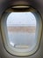 Closeup photo of water droplets on the porthole of airplane in airport