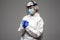 Closeup photo of woman expert doc virology center clinic wear respiratory mask hazmat blue uniform suit plastic facial protective