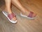 Closeup photo of woman feet in slipper sandals